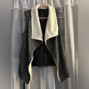 Knit, fleece collared, tie vest.